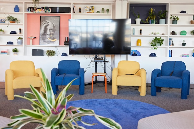 Modern lounge area with blue and yellow armchairs